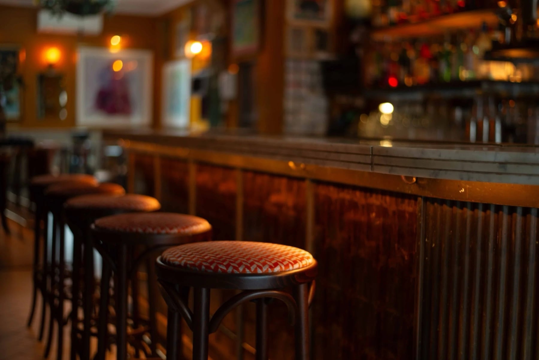 Velvet bar stools along the bar